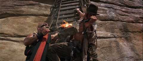 Adventurer fighting for his life on rock wall