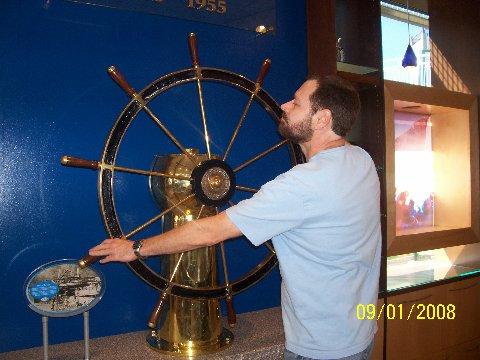 Cuy at boat's wheel