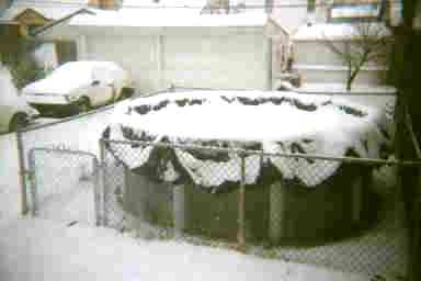 Snow on frozen swimming pool